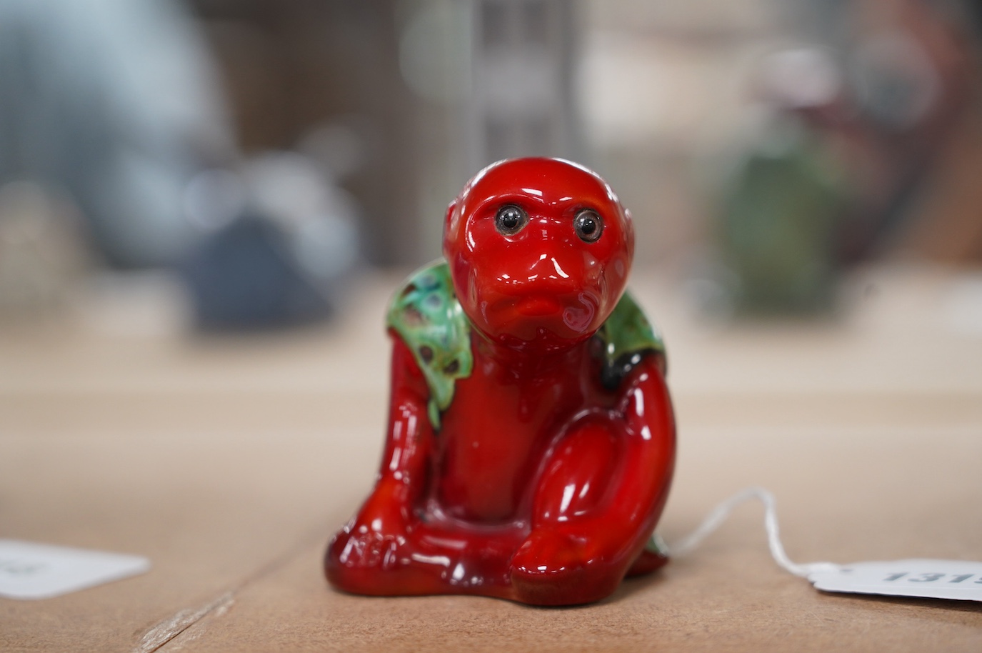 A Bernard Moore flambé monkey with crystalline glaze, c.1910, inset glass eyes, signed, 8cm high. Condition - good